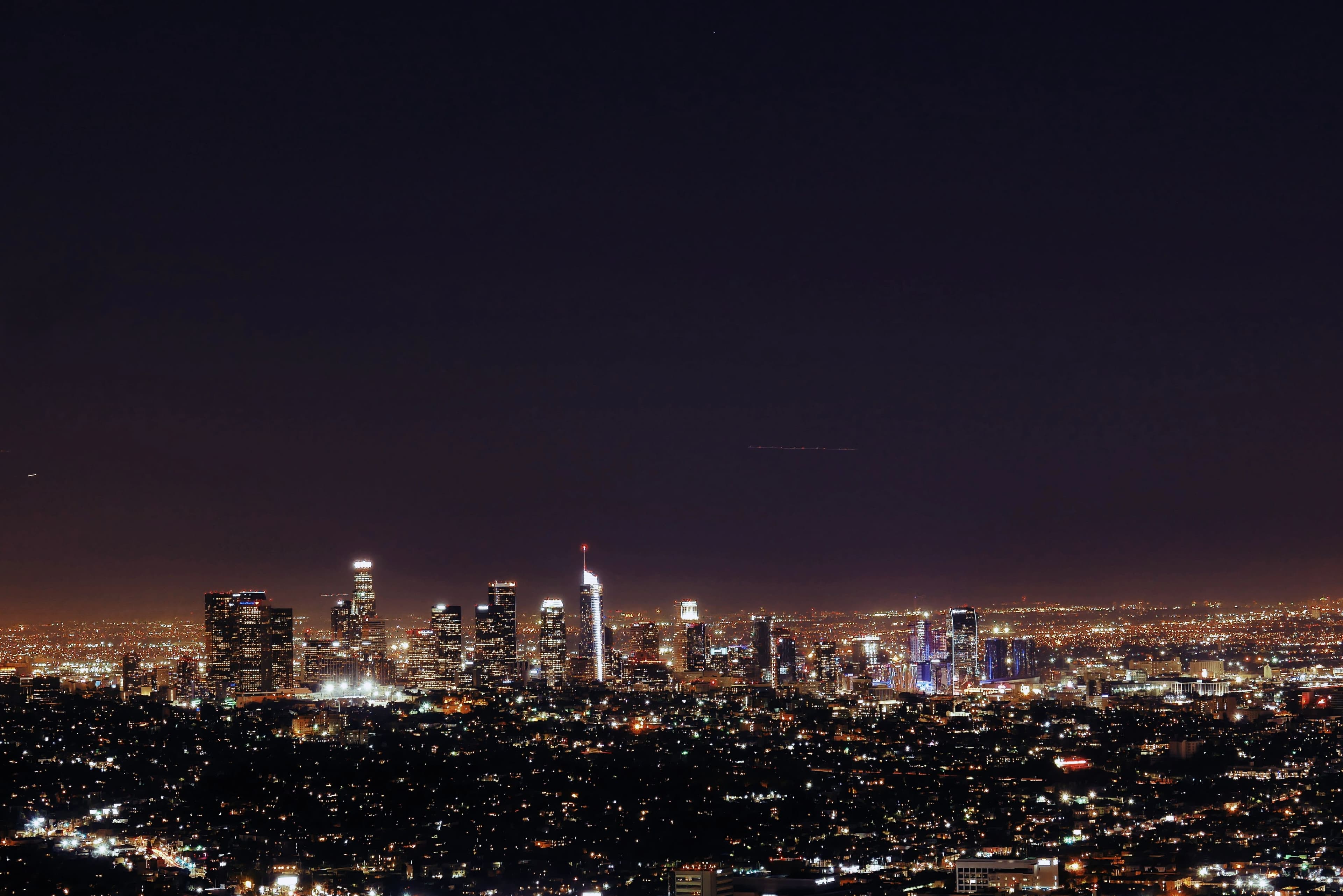 A city awakening beneath the universe